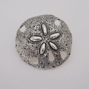 Burnished silver tone metal sand dollar pendent